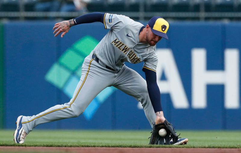 Apr 23, 2024; Pittsburgh, Pennsylvania, USA;  Milwaukee Brewers second baseman  Brice Turang (2) fields a ground ball for an out against Pittsburgh Pirates left fielder outfielder Jack Suwinski (not pictured) during the second inning at PNC Park. Mandatory Credit: Charles LeClaire-USA TODAY Sports