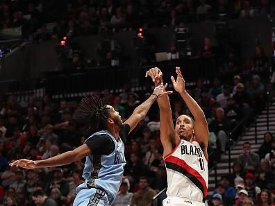 PORTLAND, OREGON - NOVEMBER 05: Malcolm Brogdon #11 of the Portland Trail Blazers shoots over Ziaire Williams #8 of the Memphis Grizzlies during the third quarter at Moda Center on November 05, 2023 in Portland, Oregon. NOTE TO USER: User expressly acknowledges and agrees that, by downloading and or using this photograph, User is consenting to the terms and conditions of the Getty Images License Agreement.? (Photo by Amanda Loman/Getty Images)