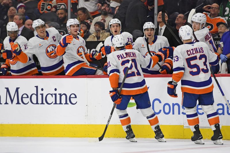 Jan 30, 2025; Philadelphia, Pennsylvania, USA; New York Islanders center Kyle Palmieri (21) celebrates his goal with teammates against the Philadelphia Flyers during the third period at Wells Fargo Center. Mandatory Credit: Eric Hartline-Imagn Images