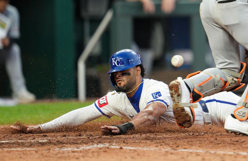 May 20, 2024; Kansas City, Missouri, USA; Kansas City Royals left fielder MJ Melendez (1) slides into home to score a run against Detroit Tigers catcher Jake Rogers (34) during the sixth inning at Kauffman Stadium. Mandatory Credit: Jay Biggerstaff-USA TODAY Sports