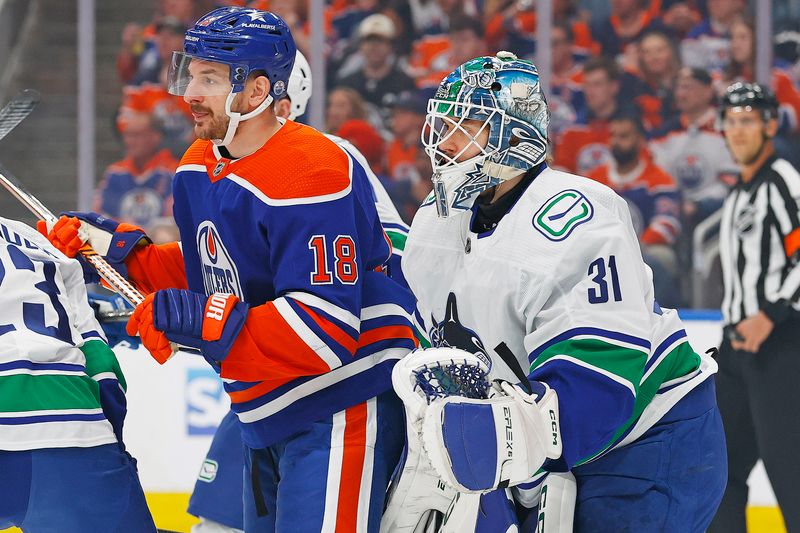 May 18, 2024; Edmonton, Alberta, CAN; Edmonton Oilers forward Zach Hyman (18) tries to screen Vancouver Canucks goaltender Arturs Silovs (31) during the first period in game six of the second round of the 2024 Stanley Cup Playoffs at Rogers Place. Mandatory Credit: Perry Nelson-USA TODAY Sports