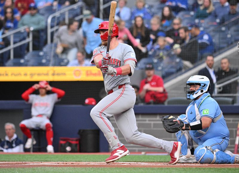 Aug 19, 2024; Toronto, Ontario, CAN; Cincinnati Reds catcher Tyler Stephenson (37) hits a single against the Toronto Blue Jays in the first inning at Rogers Centre. Mandatory Credit: Dan Hamilton-USA TODAY Sports