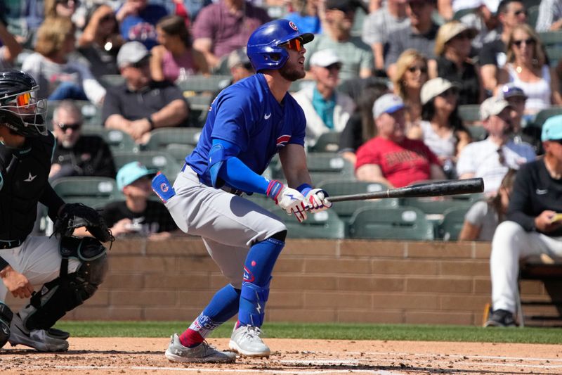 Mar 8, 2024; Salt River Pima-Maricopa, Arizona, USA; Chicago Cubs third baseman Miles Mastrobuoni (20) hits against the Arizona Diamondbacks in the second inning at Salt River Fields at Talking Stick. Mandatory Credit: Rick Scuteri-USA TODAY Sports