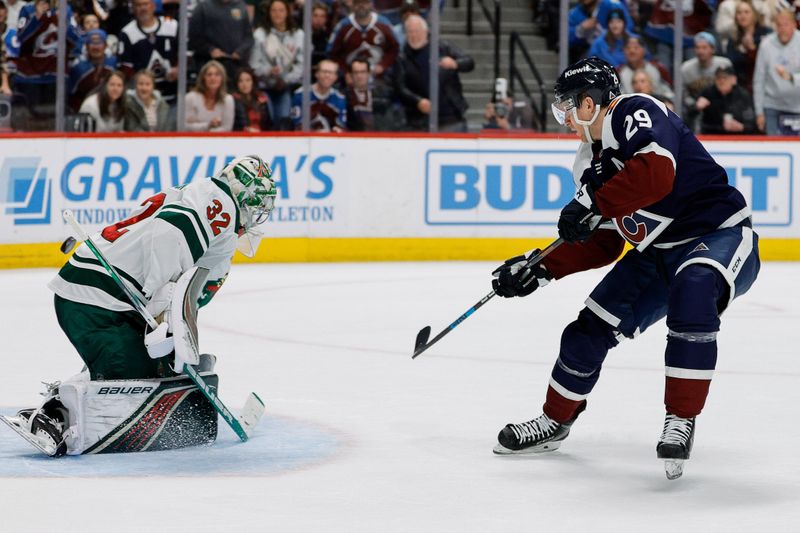 Apr 9, 2024; Denver, Colorado, USA; Colorado Avalanche center Nathan MacKinnon (29) scores his third goal of the game against Minnesota Wild goaltender Filip Gustavsson (32) in the second period at Ball Arena. Mandatory Credit: Isaiah J. Downing-USA TODAY Sports