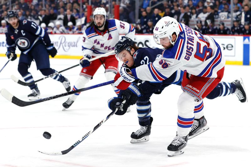 Oct 30, 2023; Winnipeg, Manitoba, CAN; New York Rangers defenseman Erik Gustafsson (56) fires the puck past Winnipeg Jets center Mason Appleton (22) in the second period at Canada Life Centre. Mandatory Credit: James Carey Lauder-USA TODAY Sports