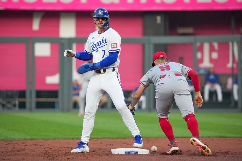 Aug 19, 2024; Kansas City, Missouri, USA; Los Angeles Angels shortstop Zach Neto (9) can’t make the tag as Kansas City Royals shortstop Bobby Witt Jr. (7) reaches second base on a wild pitch at Kauffman Stadium. Mandatory Credit: Denny Medley-USA TODAY Sports