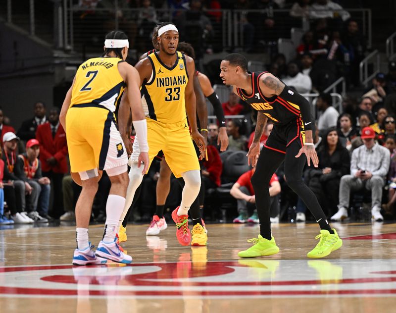 ATLANTA, GEORGIA - JANUARY 12: Dejounte Murray #5 (R) plays defense against Andrew Nembhard #2 of the Indiana Pacers during the game between the Indiana Pacers and the Atlanta Hawks on January 12, 2024 at State Farm Arena in Atlanta, Georgia.  NOTE TO USER: User expressly acknowledges and agrees that, by downloading and or using this photograph, User is consenting to the terms and conditions of the Getty Images License Agreement. (Photo by Paras Griffin/Getty Images)