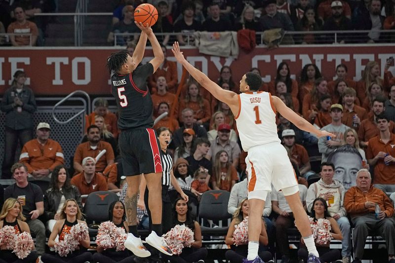 Jan 6, 2024; Austin, Texas, USA; Texas Tech Red Raiders guard Darrion Williams (5) shoots over Texas Longhorns forward Dylan Disu (1) during the first half at Moody Center. Mandatory Credit: Scott Wachter-USA TODAY Sports