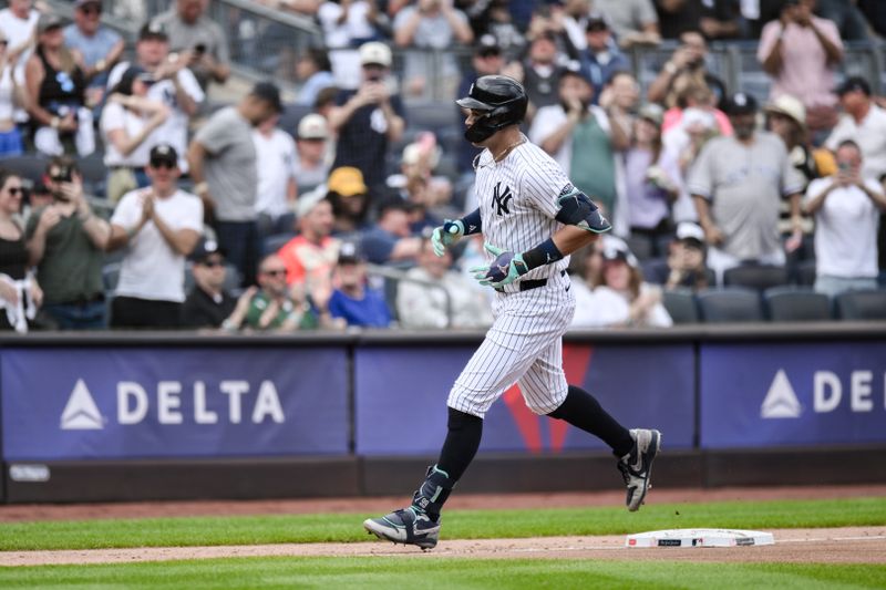 Aug 22, 2024; Bronx, New York, USA; New York Yankees outfielder Aaron Judge (99) rounds the bases after hitting a solo home run against the Cleveland Guardians during the fourth inning at Yankee Stadium. Mandatory Credit: John Jones-USA TODAY Sports