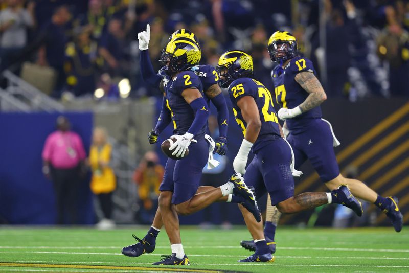 Jan 8, 2024; Houston, TX, USA; Michigan Wolverines defensive back Will Johnson (2) celebrates after a turnover against the Washington Huskies during the third quarter in the 2024 College Football Playoff national championship game at NRG Stadium. Mandatory Credit: Mark J. Rebilas-USA TODAY Sports