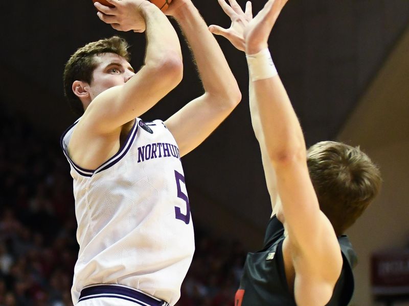 Feb 18, 2024; Bloomington, Indiana, USA;  Northwestern Wildcats guard Ryan Langborg (5) attempts a shot over Indiana Hoosiers guard Gabe Cupps (2) during the second half at Simon Skjodt Assembly Hall. Mandatory Credit: Robert Goddin-USA TODAY Sports