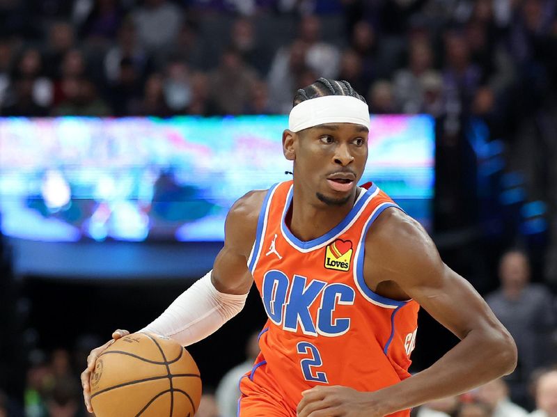 SACRAMENTO, CALIFORNIA - DECEMBER 14: Shai Gilgeous-Alexander #2 of the Oklahoma City Thunder dribbles the ball against the Sacramento Kings in the first half at Golden 1 Center on December 14, 2023 in Sacramento, California. NOTE TO USER: User expressly acknowledges and agrees that, by downloading and or using this photograph, User is consenting to the terms and conditions of the Getty Images License Agreement.  (Photo by Ezra Shaw/Getty Images)