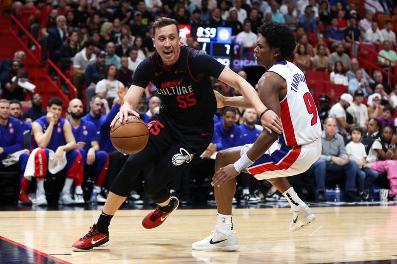 MIAMI, FLORIDA - MARCH 05: Duncan Robinson #55 of the Miami Heat drives against Ausar Thompson #9 of the Detroit Pistons during the first quarter of the game at Kaseya Center on March 05, 2024 in Miami, Florida. NOTE TO USER: User expressly acknowledges and agrees that, by downloading and or using this photograph, User is consenting to the terms and conditions of the Getty Images License Agreement. (Photo by Megan Briggs/Getty Images)