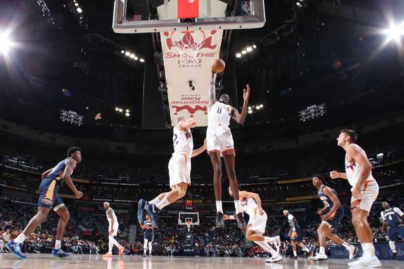 NEW ORLEANS, LA - DECEMBER 5: Bol Bol #11 of the Phoenix Suns grabs the rebound during the game against the New Orleans Pelicans on December 5, 2024 at the Smoothie King Center in New Orleans, Louisiana. NOTE TO USER: User expressly acknowledges and agrees that, by downloading and or using this Photograph, user is consenting to the terms and conditions of the Getty Images License Agreement. Mandatory Copyright Notice: Copyright 2024 NBAE (Photo by Layne Murdoch Jr./NBAE via Getty Images)