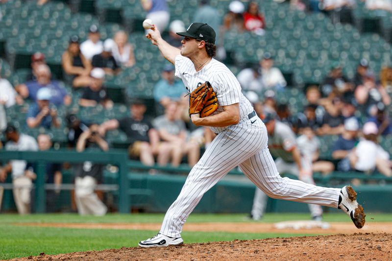 Jun 29, 2025; Chicago, Illinois, USA; Chicago White Sox relief pitcher Mike Vasil (61) delivers a pitch against the San Francisco Giants during the ninth inning at Rate Field. Mandatory Credit: Kamil Krzaczynski-Imagn Images
