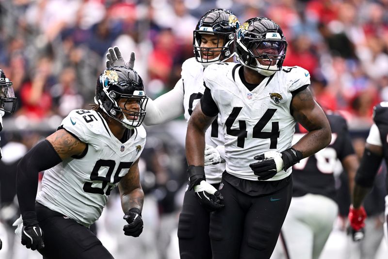 Jacksonville Jaguars defensive end Travon Walker (44) reacts in the fourth quarter against the Houston Texans during an NFL football game, Sunday, Sept. 29, 2024 in Houston. The Texans defeated the Jaguars 24-20. (AP Photo/Maria Lysaker)