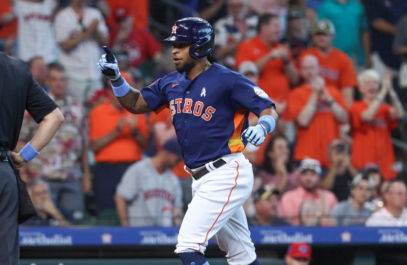 Jun 18, 2023; Houston, Texas, USA; Houston Astros left fielder Corey Julks (9) reacts after hitting a home run during the second inning against the Cincinnati Reds at Minute Maid Park. Mandatory Credit: Troy Taormina-USA TODAY Sports