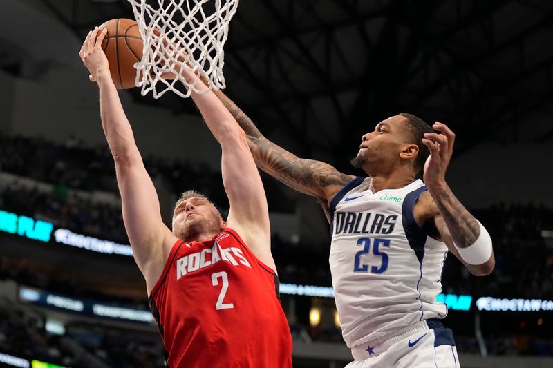 DALLAS, TEXAS - APRIL 07: P.J. Washington #25 of the Dallas Mavericks blocks Jock Landale #2 of the Houston Rockets at the basket during the second half at American Airlines Center on April 07, 2024 in Dallas, Texas. NOTE TO USER: User expressly acknowledges and agrees that, by downloading and or using this photograph, User is consenting to the terms and conditions of the Getty Images License Agreement. (Photo by Sam Hodde/Getty Images)