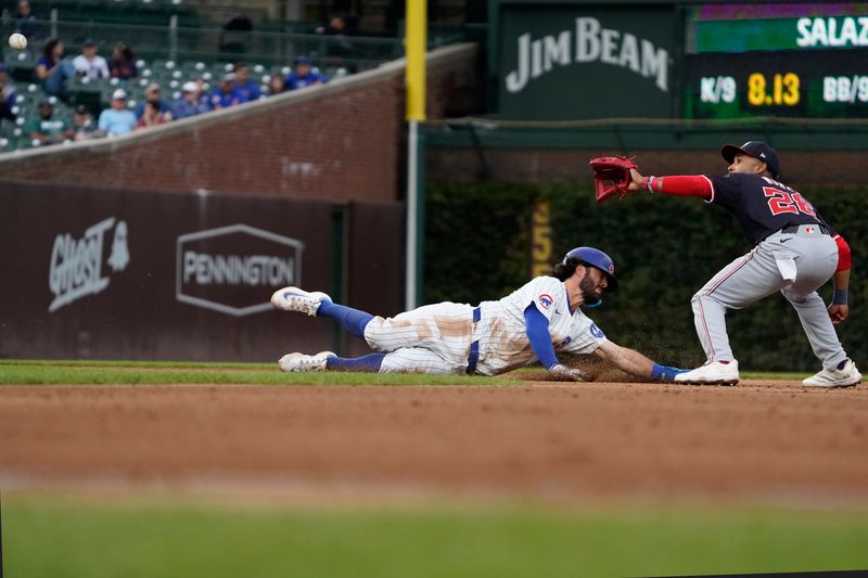 Sep 22, 2024; Chicago, Illinois, USA; Chicago Cubs shortstop Dansby Swanson (7) is picked-off of second base as Washington Nationals shortstop Nasim Nuñez (26) takes the throw during the seventh inning at Wrigley Field. Mandatory Credit: David Banks-Imagn Images