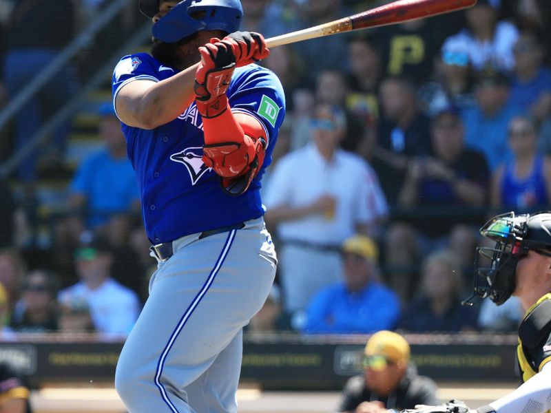 Mar 21, 2026; Bradenton, Florida, USA; Toronto Blue Jays first baseman Vladimir Guerrero Jr. (27) doubles during the first inning against the Pittsburgh Pirates  at LECOM Park. Mandatory Credit: Kim Klement Neitzel-Imagn Images