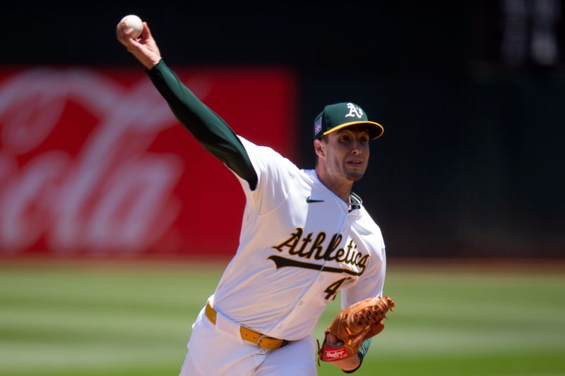 Jul 20, 2024; Oakland, California, USA; Oakland Athletics starting pitcher Mitch Spence (40) delivers a pitch against the Los Angeles Angels during the first inning at Oakland-Alameda County Coliseum. Mandatory Credit: D. Ross Cameron-USA TODAY Sports