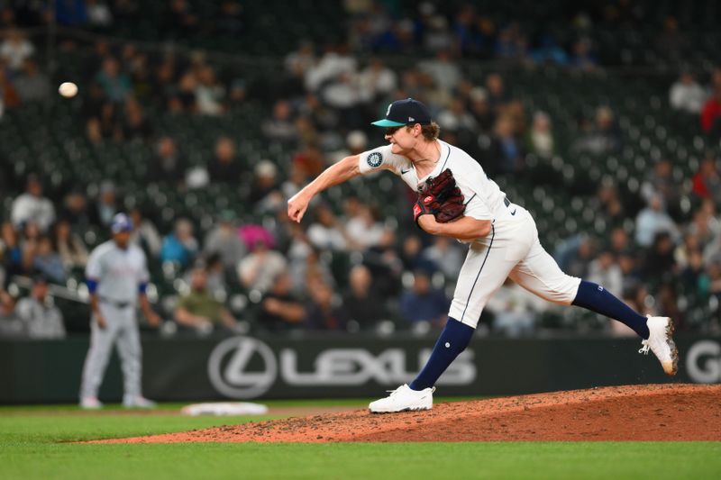 Sep 12, 2024; Seattle, Washington, USA; Seattle Mariners relief pitcher Troy Taylor (59) pitches to the Texas Rangers during the seventh inning at T-Mobile Park. Mandatory Credit: Steven Bisig-Imagn Images