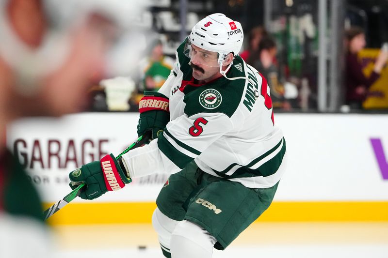 Apr 12, 2024; Las Vegas, Nevada, USA; Minnesota Wild defenseman Jake Middleton (5) warms up before the start of a game against the Vegas Golden Knights at T-Mobile Arena. Mandatory Credit: Stephen R. Sylvanie-USA TODAY Sports