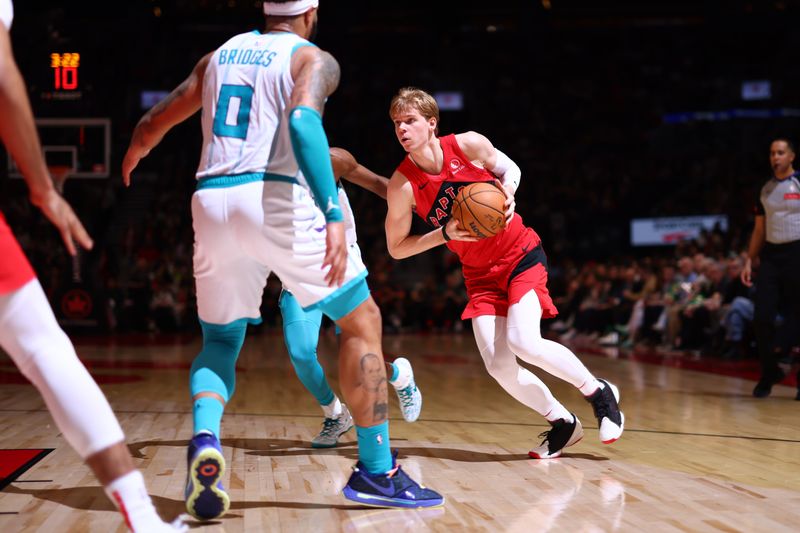 TORONTO, CANADA - MARCH 3: Gradey Dick #1 of the Toronto Raptors dribbles the ball during the game against the Charlotte Hornets on March 3, 2024 at the Scotiabank Arena in Toronto, Ontario, Canada.  NOTE TO USER: User expressly acknowledges and agrees that, by downloading and or using this Photograph, user is consenting to the terms and conditions of the Getty Images License Agreement.  Mandatory Copyright Notice: Copyright 2024 NBAE (Photo by Vaughn Ridley/NBAE via Getty Images)