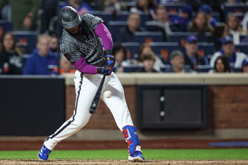 May 25, 2025; New York City, New York, USA; New York Mets left fielder Starling Marte (6) singles during the sixth inning against the Los Angeles Dodgers at Citi Field. Mandatory Credit: Vincent Carchietta-Imagn Images