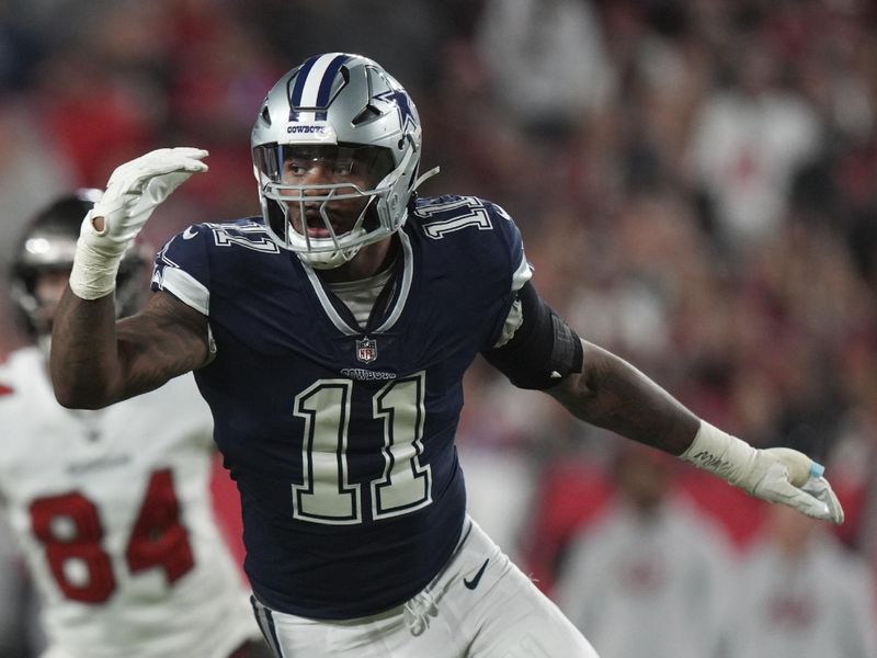 Dallas Cowboys linebacker Micah Parsons (11) blitzes the passer during an NFL wild-card football game against the Tampa Bay Buccaneers, Monday, Jan. 16, 2023, in Tampa, Fla. (AP Photo/Peter Joneleit)