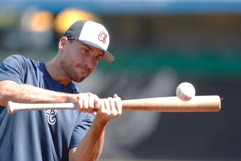 May 24, 2024; Pittsburgh, Pennsylvania, USA;  Atlanta Braves first baseman Matt Olson (28) warms up on the field before the game against the Pittsburgh Pirates at PNC Park. Mandatory Credit: Charles LeClaire-USA TODAY Sports