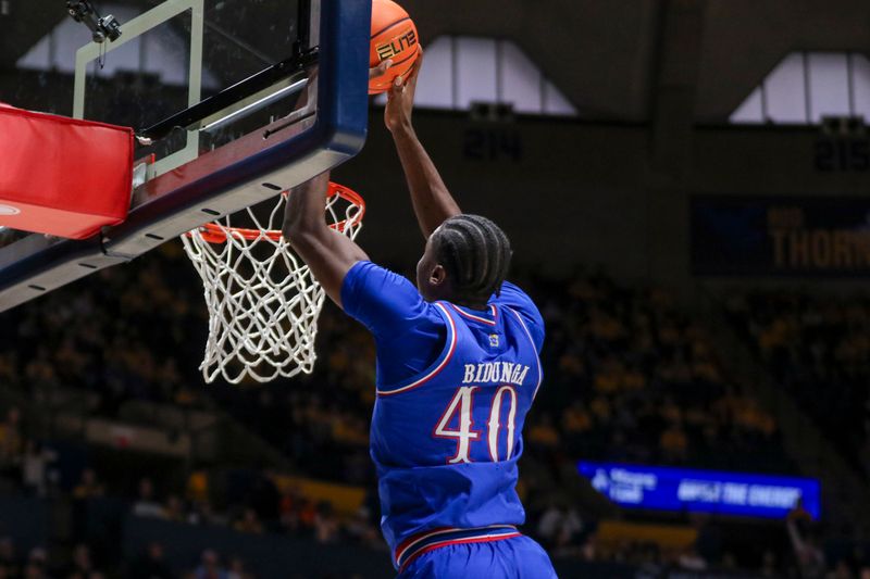 Jan 10, 2026; Morgantown, West Virginia, USA; Kansas Jayhawks forward Flory Bidunga (40) dunks the ball during the first half against the West Virginia Mountaineers at Hope Coliseum. Mandatory Credit: Ben Queen-Imagn Images