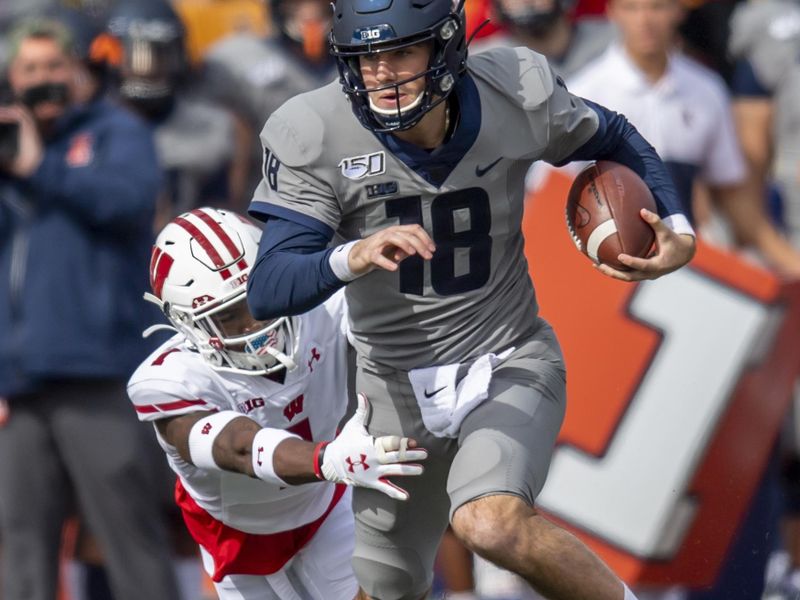 Oct 19, 2019; Champaign, IL, USA; Wisconsin Badgers cornerback Faion Hicks (1) tackles Illinois Fighting Illini quarterback Brandon Peters (18) during the first half at Memorial Stadium. Mandatory Credit: Patrick Gorski-USA TODAY Sports