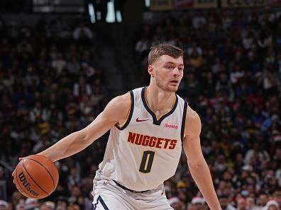 DENVER, CO - DECEMBER 25: Christian Braun #0 of the Denver Nuggets handles the ball during the game against the Golden State Warriors on December 25, 2023 at the Ball Arena in Denver, Colorado. NOTE TO USER: User expressly acknowledges and agrees that, by downloading and/or using this Photograph, user is consenting to the terms and conditions of the Getty Images License Agreement. Mandatory Copyright Notice: Copyright 2023 NBAE (Photo by Bart Young/NBAE via Getty Images)