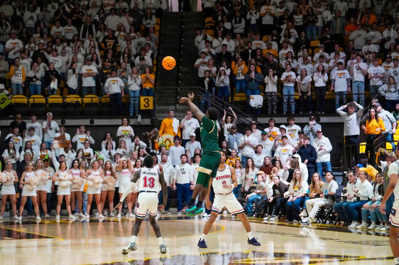 Jan 27, 2024; Laramie, Wyoming, USA; Colorado State Rams forward Isaiah Stevens (4) takes the final shot at the overtime buzzer against the Wyoming Cowboys at Arena-Auditorium. Mandatory Credit: Troy Babbitt-USA TODAY Sports