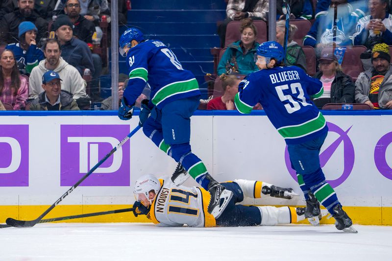 Nov 17, 2024; Vancouver, British Columbia, CAN; Vancouver Canucks forward Conor Garland (8)1 and forward Teddy Blueger (53) check Nashville Predators forward Gustav Nyquist (14) during the first period at Rogers Arena. Mandatory Credit: Bob Frid-Imagn Images