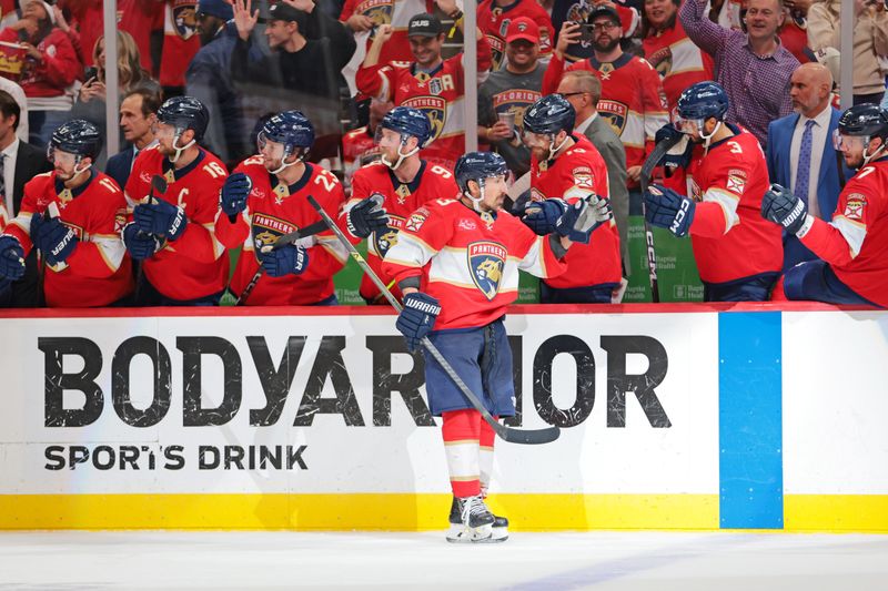 May 24, 2025; Sunrise, Florida, USA; Florida Panthers center Brad Marchand (63) celebrates after a goal during the third period against the Carolina Hurricanes in game three of the Eastern Conference Final of the 2025 Stanley Cup Playoffs at Amerant Bank Arena. Mandatory Credit: Sam Navarro-Imagn Images