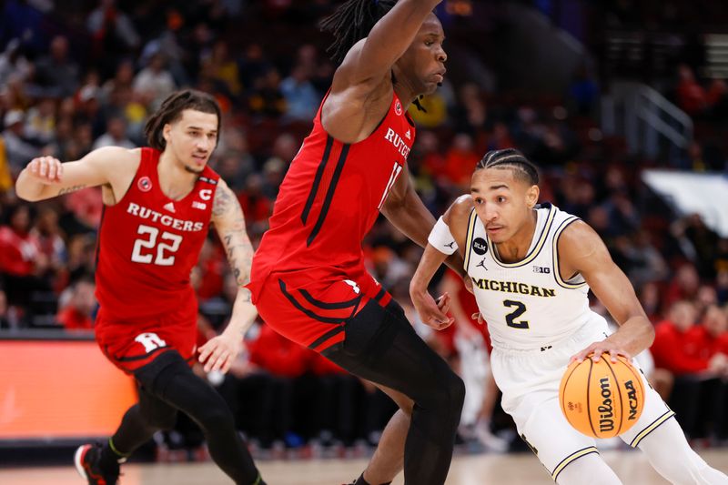 Mar 9, 2023; Chicago, IL, USA; Michigan Wolverines guard Kobe Bufkin (2) drives to the basket against Rutgers Scarlet Knights center Clifford Omoruyi (11) during the second half at United Center. Mandatory Credit: Kamil Krzaczynski-USA TODAY Sports