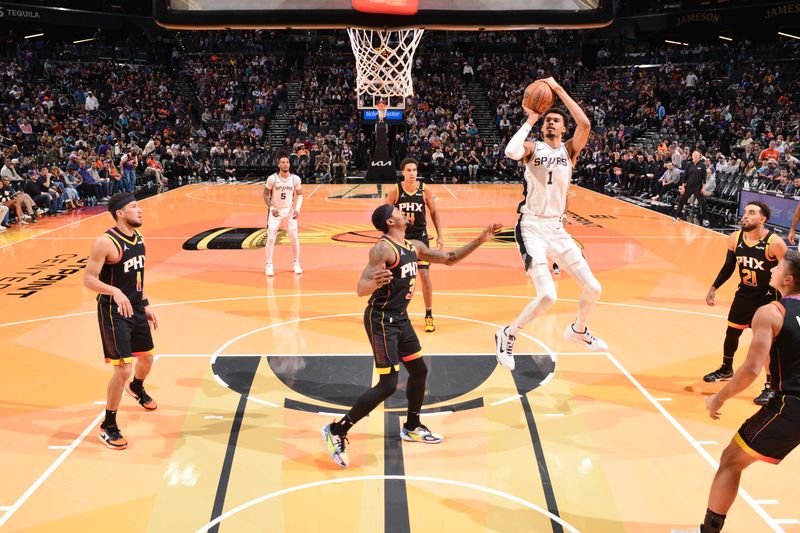 PHOENIX, AZ - DECEMBER 3: Victor Wembanyama #1 of the San Antonio Spurs shoots the ball during the game against the Phoenix Suns during a Emirates NBA Cup game on December 3, 2024 at Footprint Center in Phoenix, Arizona. NOTE TO USER: User expressly acknowledges and agrees that, by downloading and or using this photograph, user is consenting to the terms and conditions of the Getty Images License Agreement. Mandatory Copyright Notice: Copyright 2024 NBAE (Photo by Barry Gossage/NBAE via Getty Images)