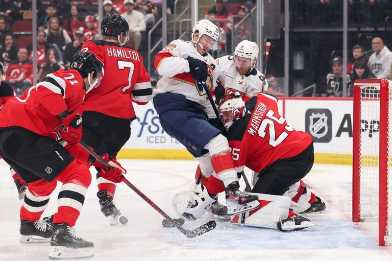 Mar 3, 2026; Newark, New Jersey, USA; New Jersey Devils goaltender Jacob Markstrom (25) makes a save against the Florida Panthers during the first period at Prudential Center. Mandatory Credit: Ed Mulholland-Imagn Images
