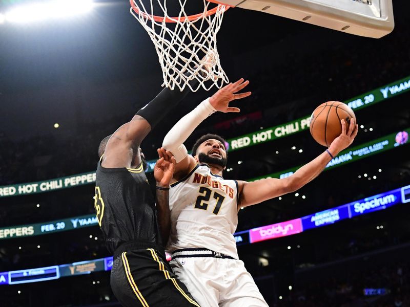 LOS ANGELES, CA - FEBRUARY 8: Jamal Murray #27 of the Denver Nuggets drives to the basket during the game against the Los Angeles Lakers on February 8, 2024 at Crypto.Com Arena in Los Angeles, California. NOTE TO USER: User expressly acknowledges and agrees that, by downloading and/or using this Photograph, user is consenting to the terms and conditions of the Getty Images License Agreement. Mandatory Copyright Notice: Copyright 2024 NBAE (Photo by Adam Pantozzi/NBAE via Getty Images)