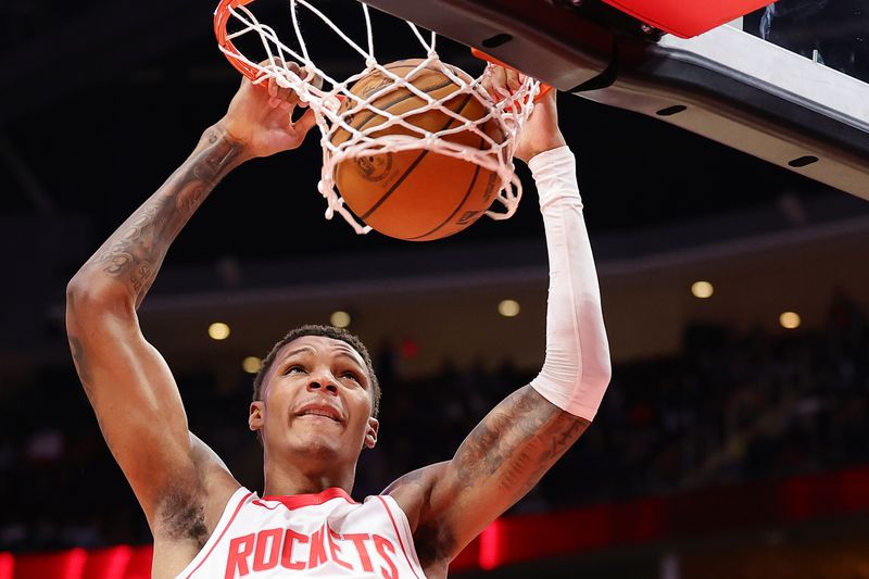 HOUSTON, TEXAS - OCTOBER 17: Jabari Smith Jr. #10 of the Houston Rockets slam dunks the ball during the first half of a preseason game against the San Antonio Spurs at Toyota Center on October 17, 2024 in Houston, Texas. NOTE TO USER: User expressly acknowledges and agrees that, by downloading and or using this photograph, User is consenting to the terms and conditions of the Getty Images License Agreement. (Photo by Alex Slitz/Getty Images)