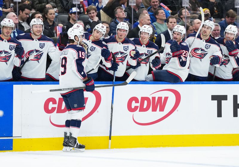 Nov 20, 2025; Toronto, Ontario, CAN; Columbus Blue Jackets center Adam Fantilli (19) celebrates at the bench after scoring a goal against the Toronto Maple Leafs during the second period at Scotiabank Arena. Mandatory Credit: Nick Turchiaro-Imagn Images