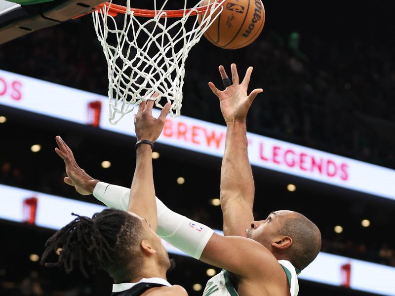 BOSTON, MASSACHUSETTS - FEBRUARY 04: Al Horford #42 of the Boston Celtics shoots against Tosan Evbuomwan #18 of the Memphis Grizzlies at TD Garden on February 04, 2024 in Boston, Massachusetts. NOTE TO USER: User expressly acknowledges and agrees that, by downloading and or using this photograph, User is consenting to the terms and conditions of the Getty Images License Agreement. (Photo by Paul Rutherford/Getty Images)