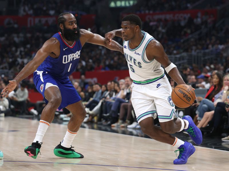 LOS ANGELES, CALIFORNIA - MARCH 12: Anthony Edwards #5 of the Minnesota Timberwolves drives to the basket on James Harden #1 of the LA Clippers during the first half at Crypto.com Arena on March 12, 2024 in Los Angeles, California. (Photo by Harry How/Getty Images)