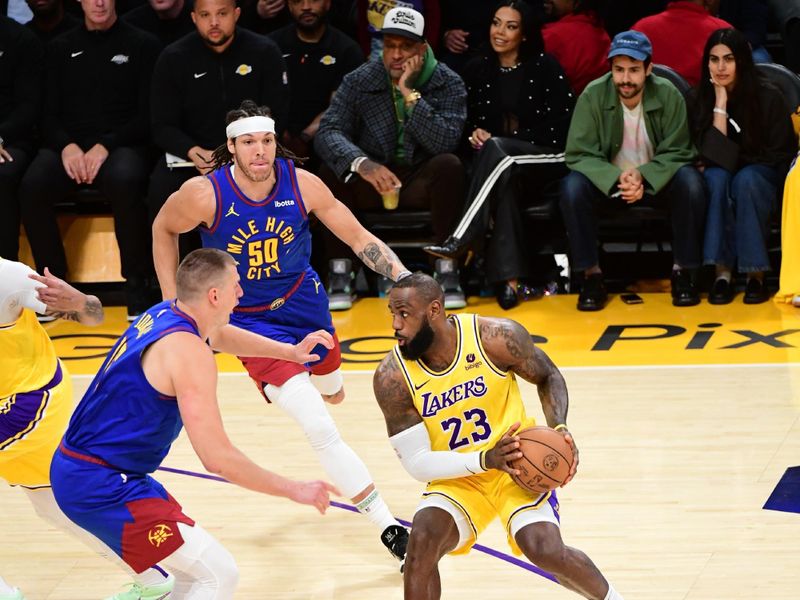 LOS ANGELES, CA - APRIL 25: LeBron James #23 of the Los Angeles Lakers handles the ball during the game against the Denver Nuggets during Round One Game Three of the 2024 NBA Playoffs on April 25, 2024 at Crypto.Com Arena in Los Angeles, California. NOTE TO USER: User expressly acknowledges and agrees that, by downloading and/or using this Photograph, user is consenting to the terms and conditions of the Getty Images License Agreement. Mandatory Copyright Notice: Copyright 2024 NBAE (Photo by Adam Pantozzi/NBAE via Getty Images)