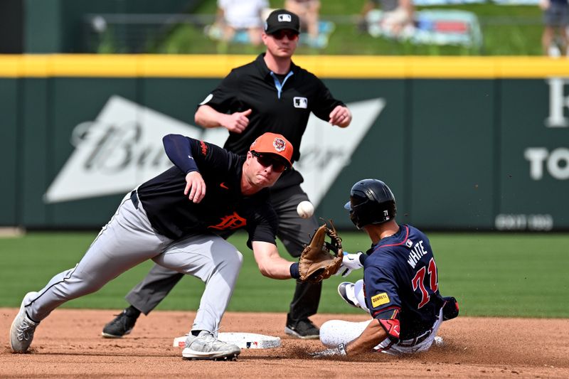 Mar 5, 2024; North Port, Florida, USA; Detroit Tigers second baseman Colt Keith (33) catches the ball as Atlanta Braves left fielder Forrest Wall (73) slides into second base  in the second inning of the spring training game at CoolToday Park. Mandatory Credit: Jonathan Dyer-USA TODAY Sports