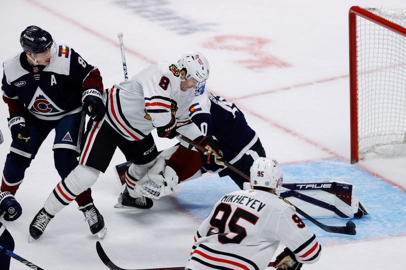 Oct 28, 2024; Denver, Colorado, USA; Chicago Blackhawks center Ryan Donato (8) scores a goal against Colorado Avalanche goaltender Alexandar Georgiev (40) as defenseman Cale Makar (8) and right wing Ilya Mikheyev (95) look on in the first period at Ball Arena. Mandatory Credit: Isaiah J. Downing-Imagn Images