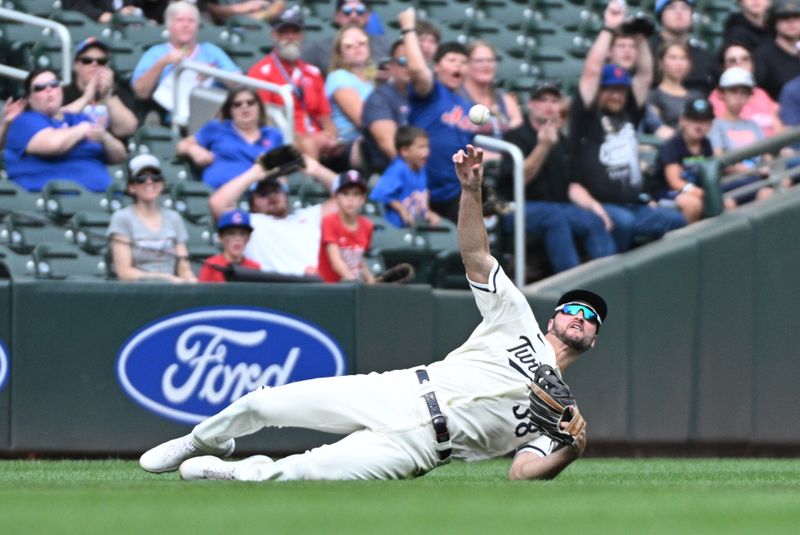 Sep 10, 2023; Minneapolis, Minnesota, USA; Minnesota Twins right fielder Matt Wallner (38) dove for the ball couldn   t come up with the catch in the ninth inning against the New York Mets at Target Field. Mandatory Credit: Michael McLoone-USA TODAY Sports