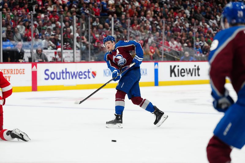 Mar 6, 2024; Denver, Colorado, USA; Colorado Avalanche defenseman Cale Makar (8) passes the puck in the second period against the Detroit Red Wings at Ball Arena. Mandatory Credit: Ron Chenoy-USA TODAY Sports